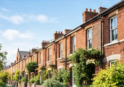 A street of brick terraced homes in daylight