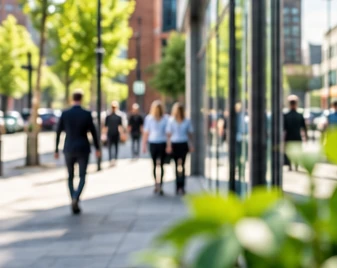 People walking beside contemporary city-centre offices